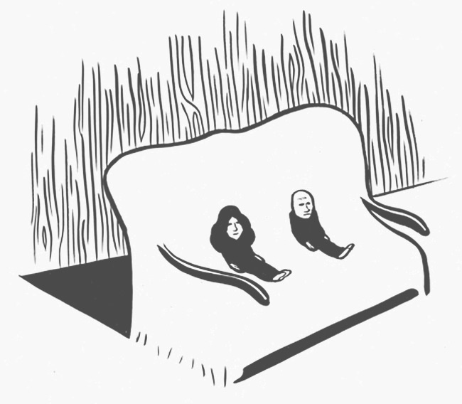 two people sitting on a couch